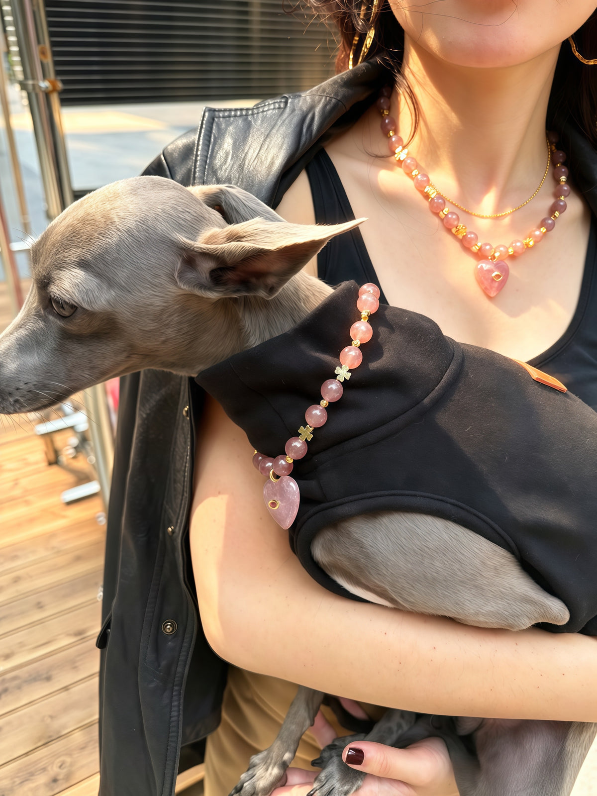 Pet mom holding Italian Greyhound wearing matching strawberry quartz heart crystal necklace and dog collar – Muttu
