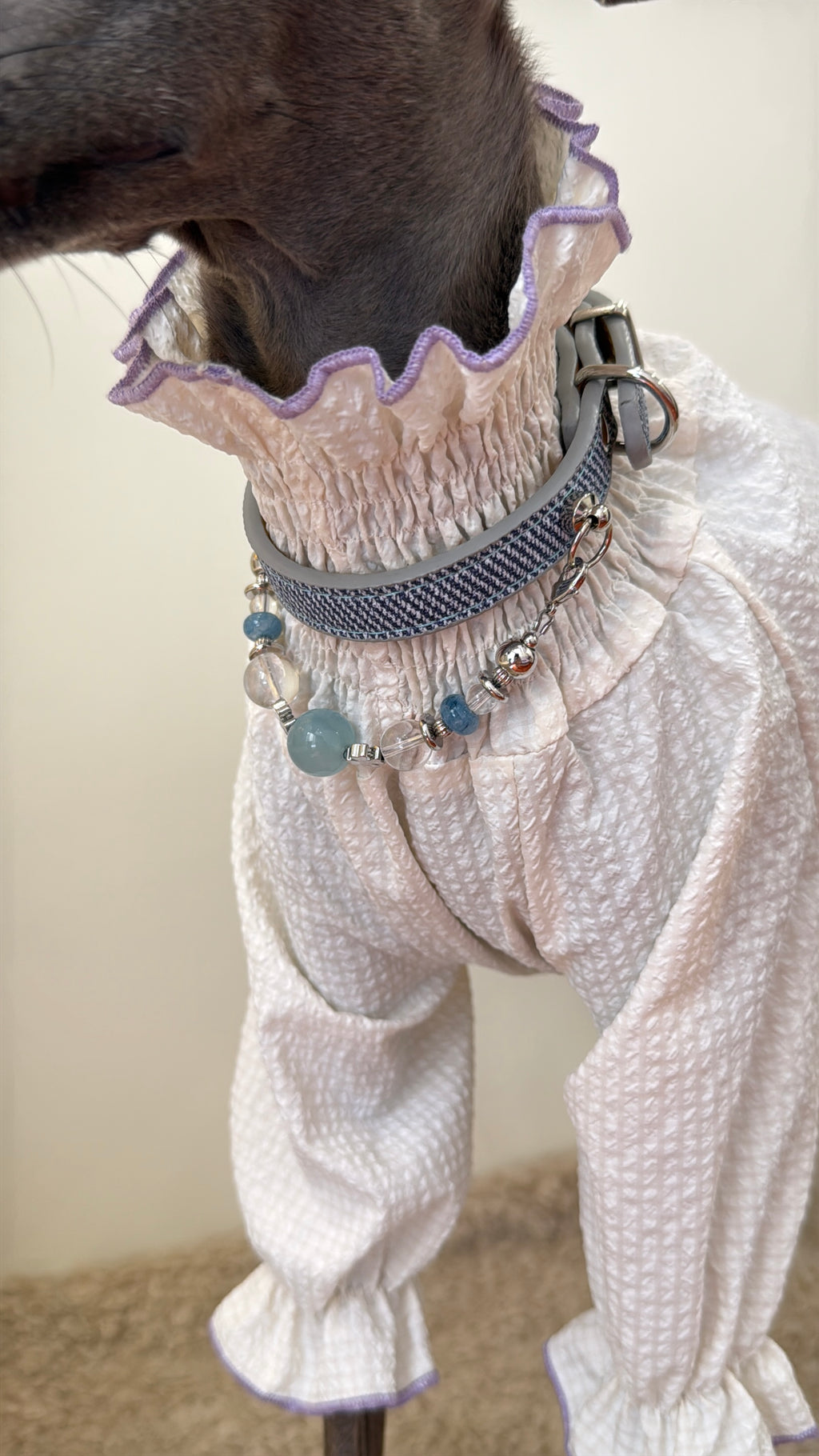 Macro detail of the Celestial Aqua dog collar showing natural aquamarine beads, clear quartz, and woven strap