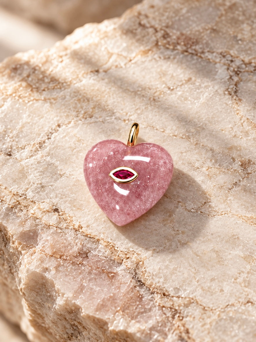 Handcrafted pink strawberry quartz crystal heart pet charm featuring a marquise ruby eye in 14K gold bezel – Muttu
