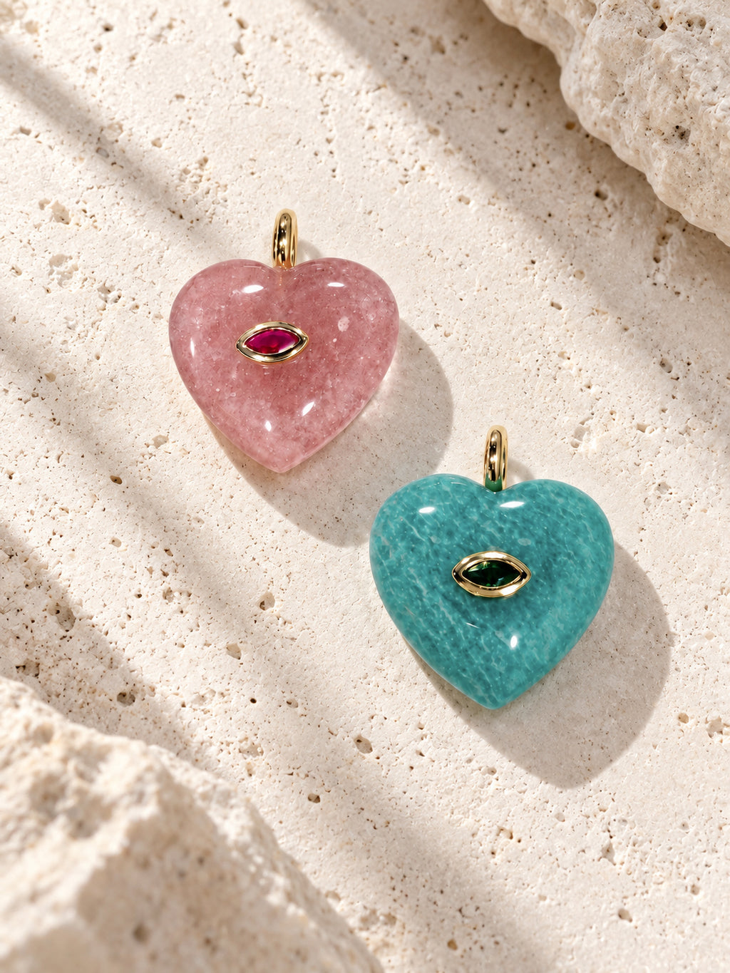 Pink strawberry quartz and green amazonite handmade crystal heart pet charms displayed side by side – Muttu
