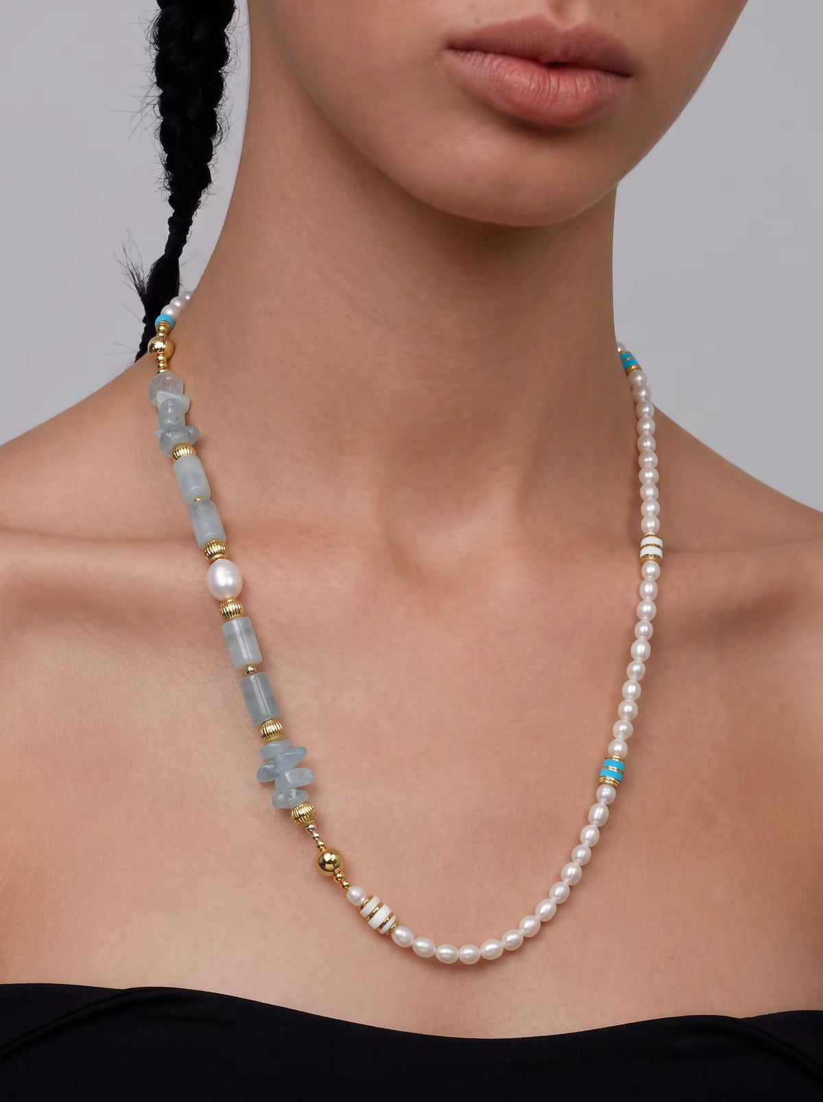 Tidal Isle 2-in-1 Magnetic Crystal Necklace – Muttu brand campaign hero image featuring aquamarine and freshwater pearl necklace, editorial lifestyle styling